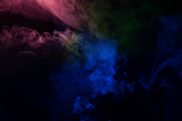 istock Green and pink steam on a black background. 1739161540