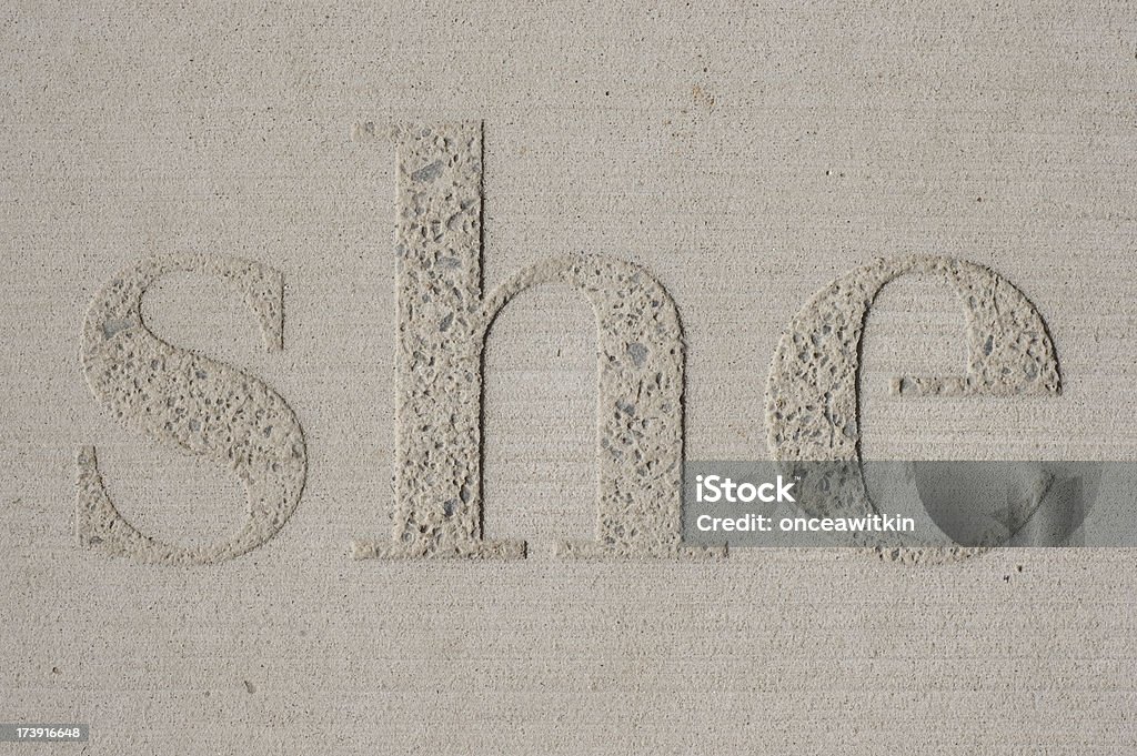 Palabra'she'grabado en cemento - Foto de stock de Brocado libre de derechos