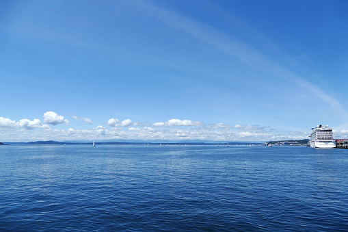 Looking out at a generic cruise ship and sailboats in Puget Sound in Seattle, Washington.