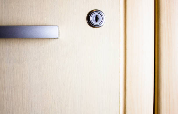 istock Light wardrobe chest of drawers with a lock. Personal wardrobe with a closed lock. 1739176079
