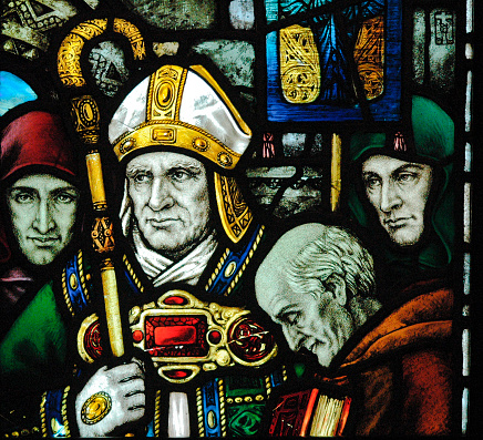 Very old stained glass window depicting St Patrick taken in County Cork Ireland
