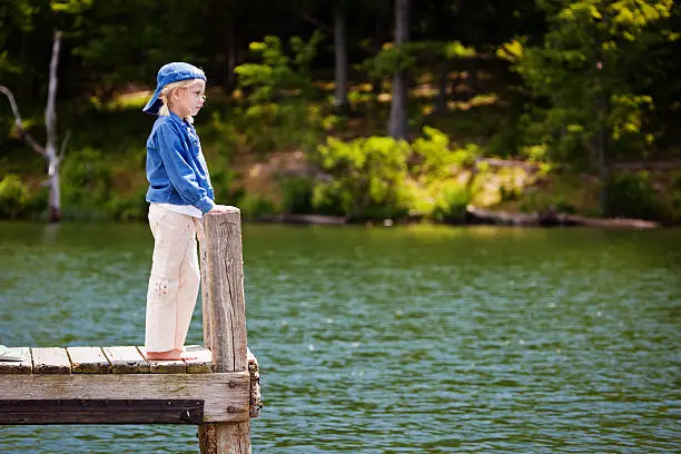 Tomboy Standing on Dock