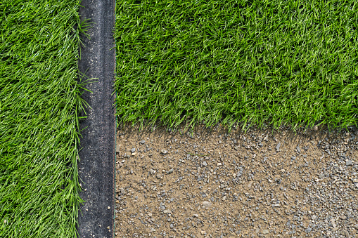 Artificial turf taken from the top. Artificial grass close-up. Artificial turf background.