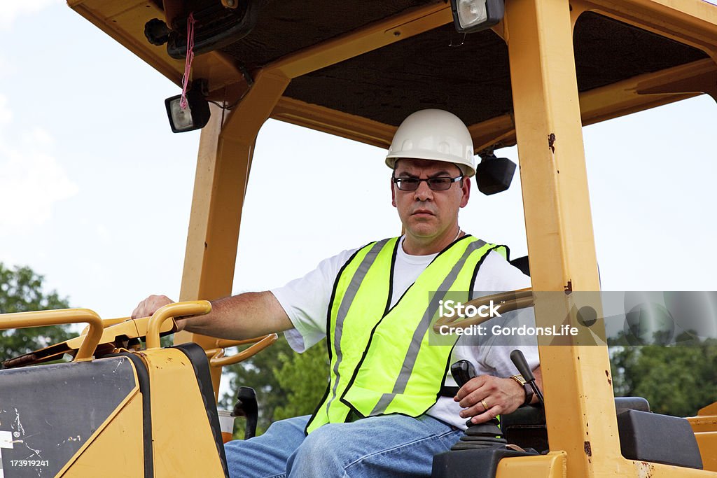 Uomo in un Buldozer - Foto stock royalty-free di Abilità