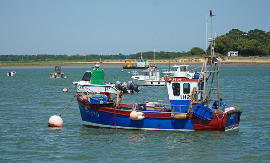 Felixstowe, Suffolk, England - June 14, 2023: Fishing boats in the river Deben estuary.
