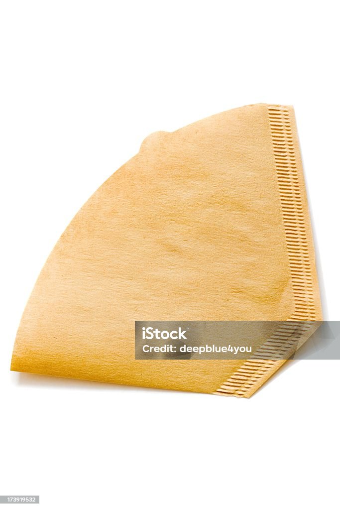 One unbleached brown coffee filter on white "unbleached brown coffee filter, isolated on white background" Coffee Filter Stock Photo