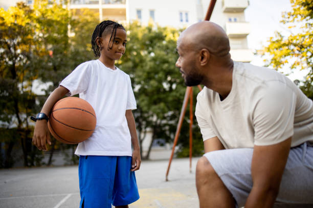 istock Father preparing for a basketball play with his boy 1739195551
