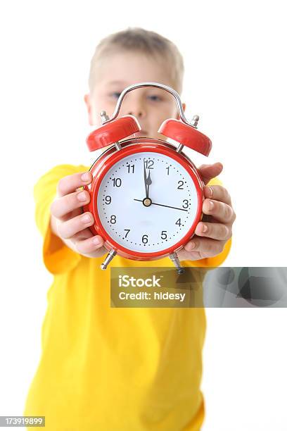 Boy Holding Alarm Clock Stock Photo - Download Image Now - Alarm Clock, Bedtime, Boys