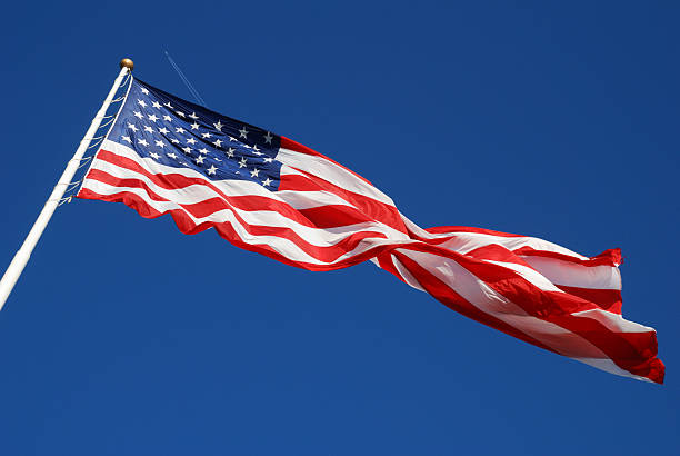 istock American Flag with Airplane Traile 173920466