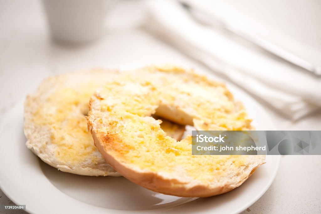 toasted buttered bagels toasted buttered plain bagels for breakfast. Bagel Stock Photo