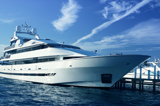 A luxury yacht docked in the marina.