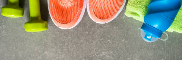 istock Fitness equipment at stone background top view. 1739215403