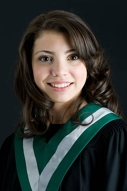 Beautiful Grad Young Girl graduates from school. high school photos stock pictures, royalty-free photos & images