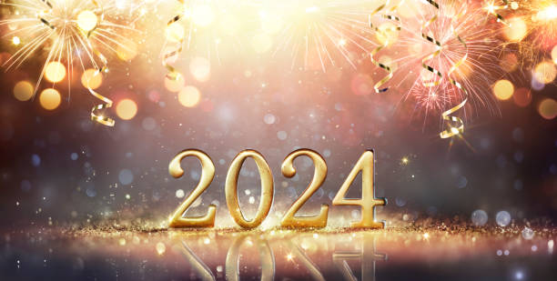 2024 Frohes Neues Jahr - Goldene Zahl auf Glitzer und Feuerwerk in abstrakten, unscharfen Lichtern – Foto