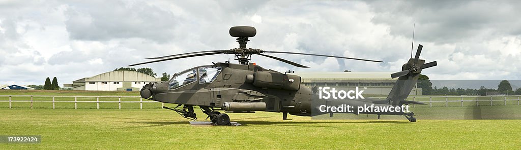 Mean Machine "Attack helicopter armed to the teeth, standing by in an airfield ready for action." US Military Stock Photo