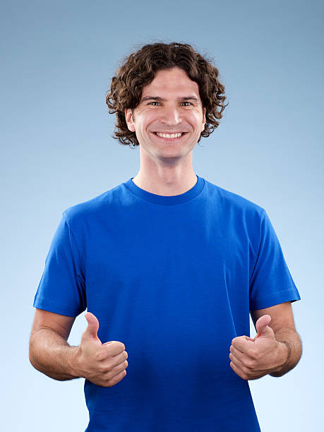 istock Smiling, young white male with two thumbs up! 173922709