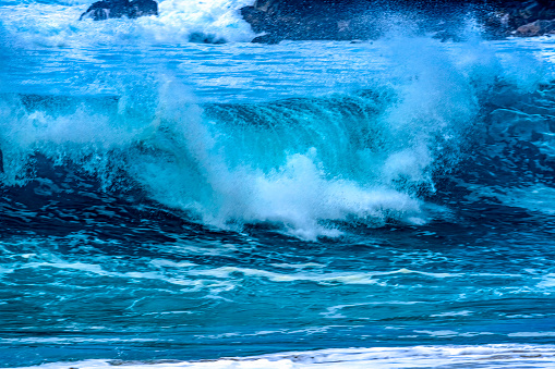 Watching Large Wave Waimea Bay North Shore Oahu Hawaii. Waimea Bay is famous for big wave surfing. On this day, waves were 15 to 20 feet high.