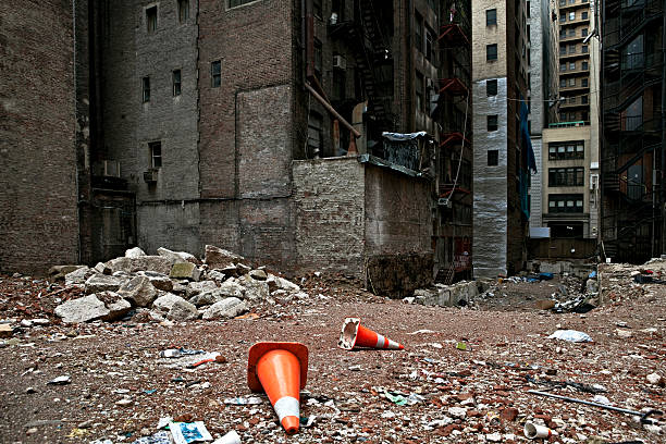 Urban Architecture Abandoned lot amidst broken down buildings. Midtown Manhattan. empty lot construction stock pictures, royalty-free photos & images