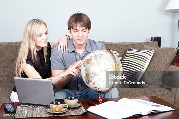 Planning A Vacation Stock Photo - Download Image Now - Couple - Relationship, Globe - Navigational Equipment, Adult