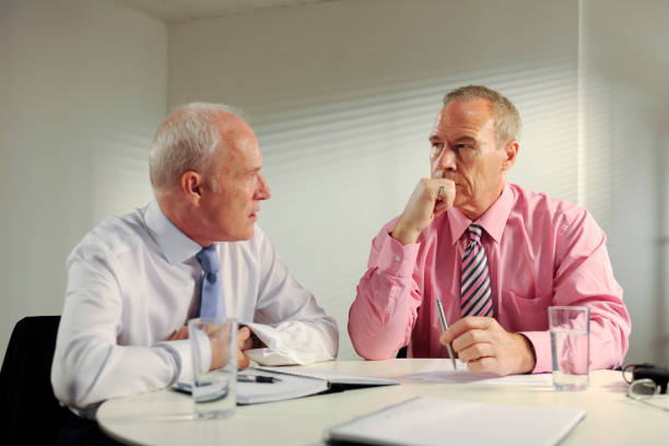 istock senior business men in meeting 173923827