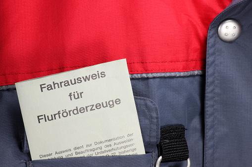 German driving license for forklift trucks in workwear breast pocket