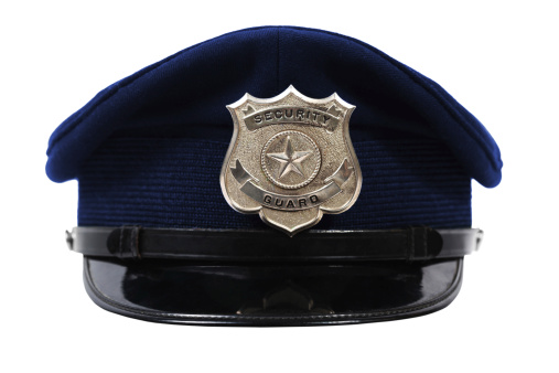 Generic security Guard badge on a blue hat.