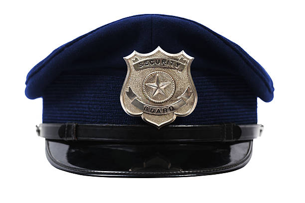 Hat with security guard badge Generic security Guard badge on a blue hat. prison guard stock pictures, royalty-free photos & images