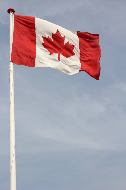 istock Canadian flag flying in the wind 1739253069