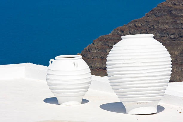 istock two big pottery vases on a sunny terrace 173925818