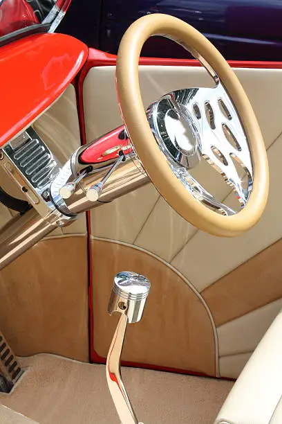 Photo of Steering wheel and gear lever inside a custom car
