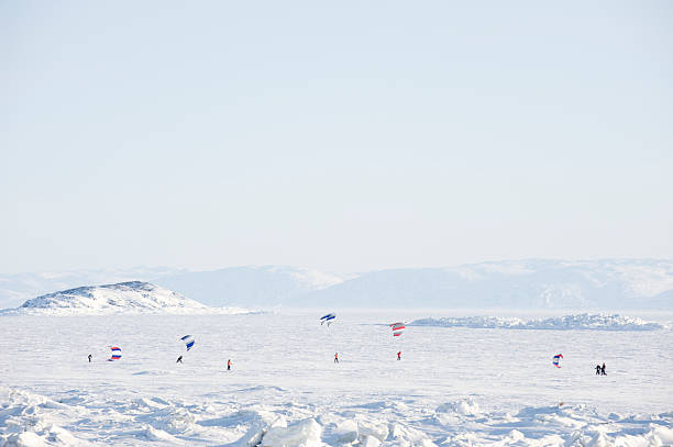 Perm, Russia - February 23, 2018: snowkiters glides on the ice of the Kama Reservoir