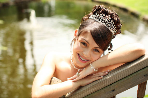 Beautiful Quinceanera Young teen wearing a quinceanera dress on her 15th birthday. quinceanera stock pictures, royalty-free photos & images