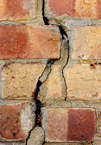 istock Crack in a brick wall of a house discovered during a survey 173927202