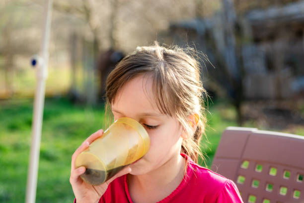 istock Girl drinking a juice in the yard 1739274006
