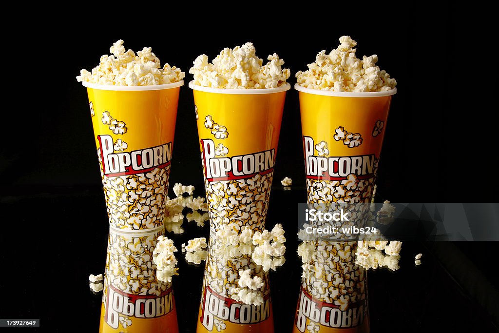 Popcorn Three popcorn containers. Popcorn Stock Photo