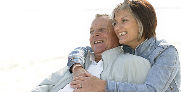 istock Senior couple relaxing on beach 173927721