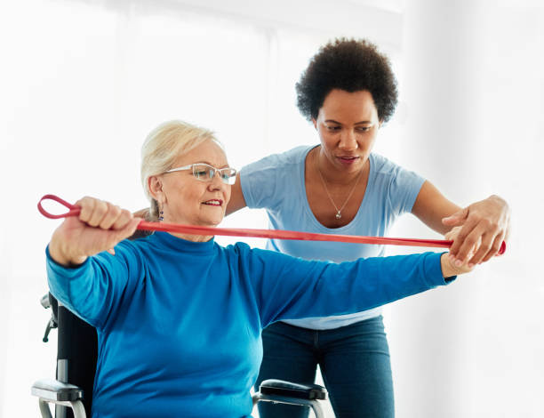 istock senior care exercise physical therapy exercising help assistence retirement home physiotherapy physiotherapist fitness gym strech band clinic therapist elderly woman band stretching 1739278390