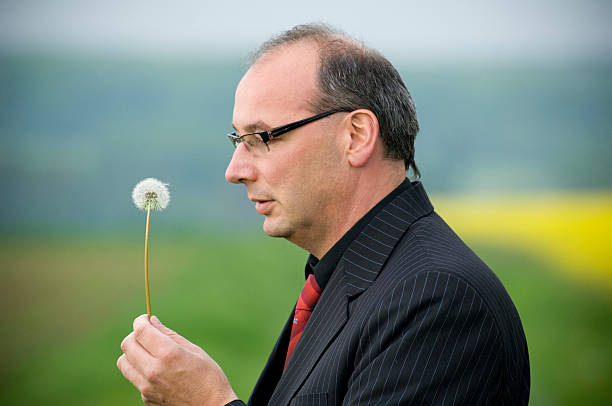 istock Businessman with dandelion 173927918