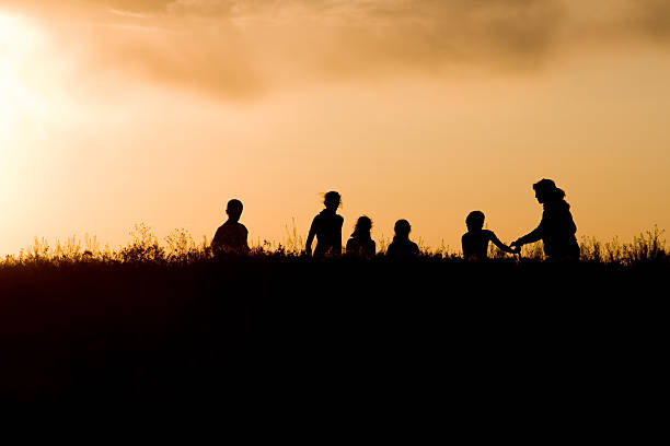istock Family at Sunset 173928009