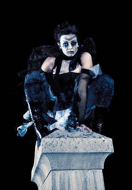 istock Creepy Dark Angel on Tombstone in Graveyard 173928570