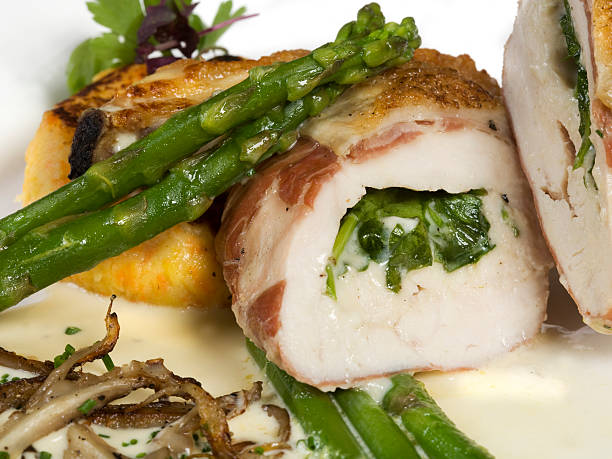 Stuffed chicken with asparagus stock photo