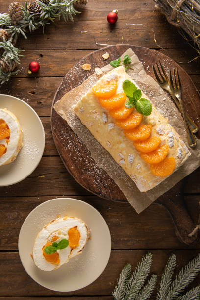 istock Meringue roll cake with cream, tangerine. 1739288956