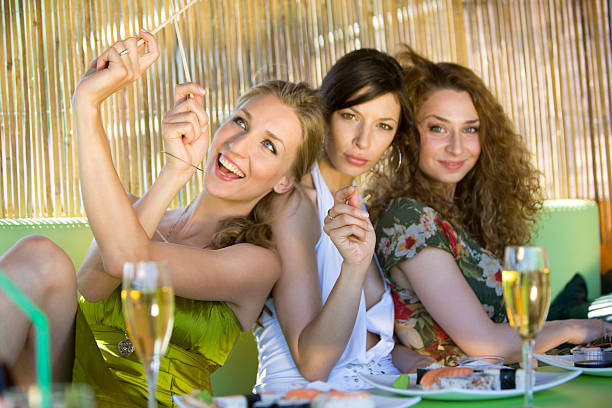 istock Friends sitting at the sushi bar 173929317