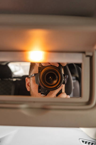 istock man take picture in mirror with camera 1739302279