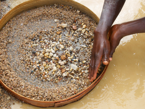 A man washing diamonds in a mine in Kono - Sierra Leone