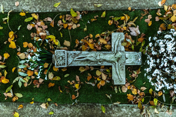 istock religious cross with Jesus image on the grave 1739304966