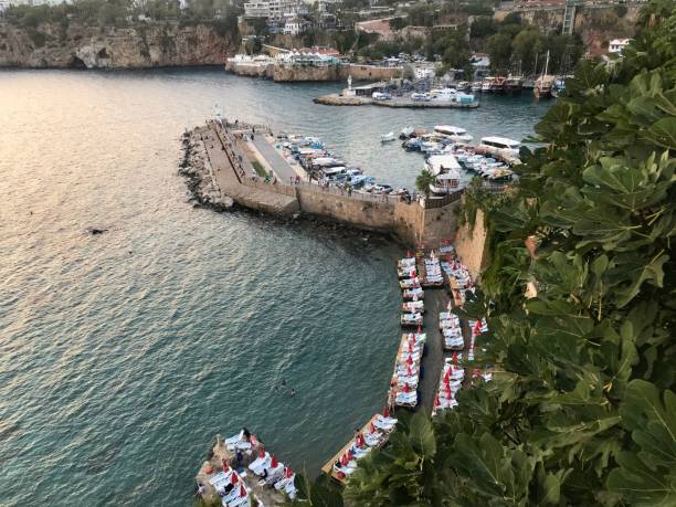 the old port of antalya. city landscape. panoramic picture. antalya yat limanı, muratpasa. on the sunset. - antique ship imagens e fotografias de stock