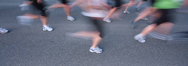 istock Runners Legs at a Cross Country Relay Race Start 173930729