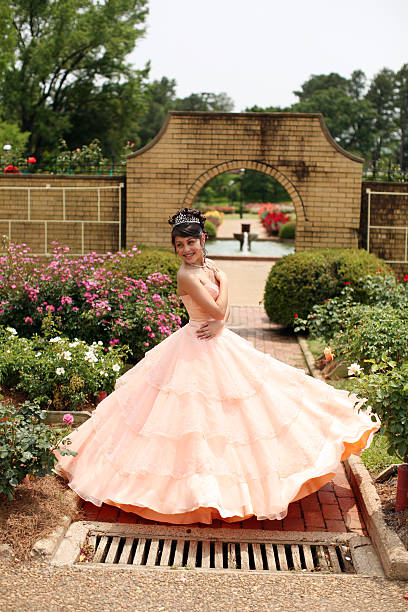 Young Quinceanera Young teen wearing a quinceanera dress on her 15th birthday quinceanera stock pictures, royalty-free photos & images