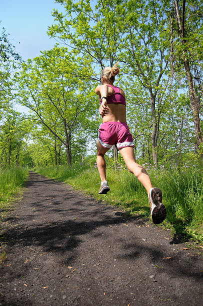 Woman Runner on Trail stock photo
